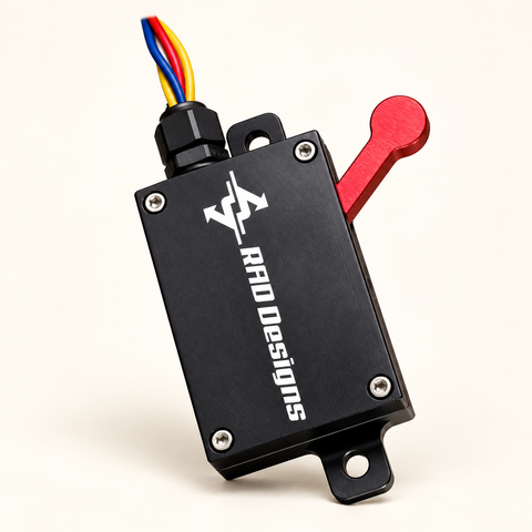 RAD VX Rail Controller with black housing and red lever on a cream background.